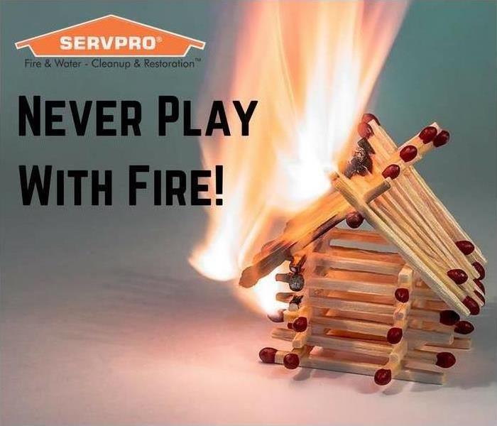 matches positioned to resemble a house and the text, "never play with fire." 