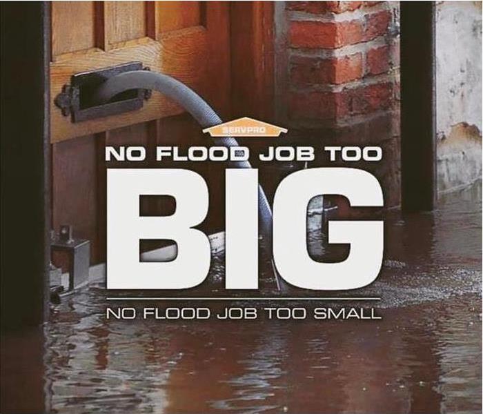 Flood on wood flooring with a wooden door and a hose coming out of the door. 